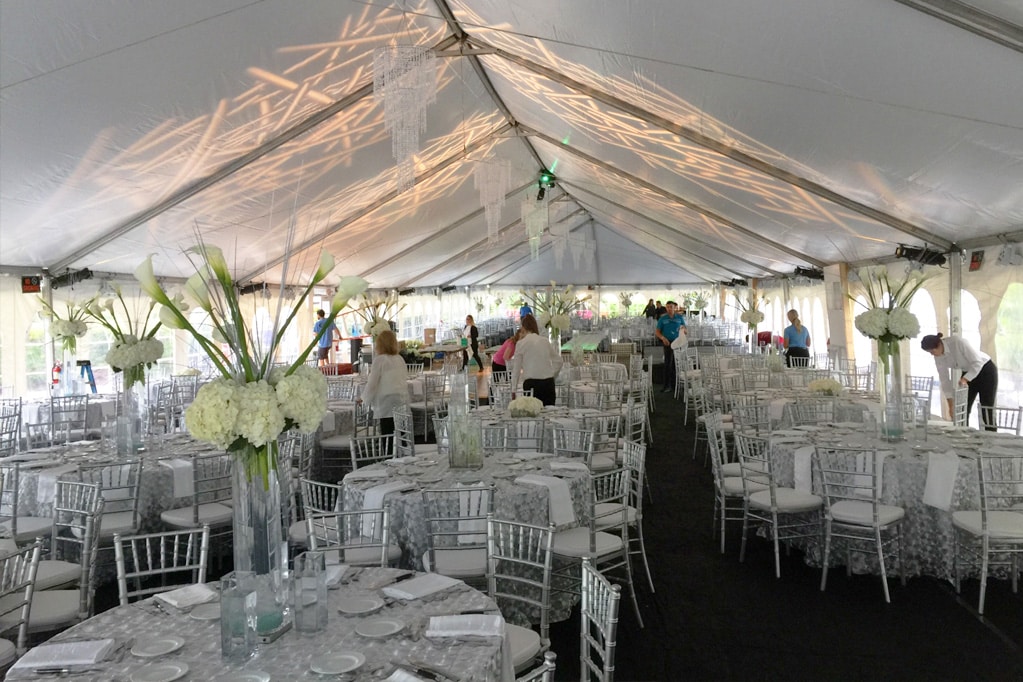 Outdoor tent party setup by Creative Events & Rentals